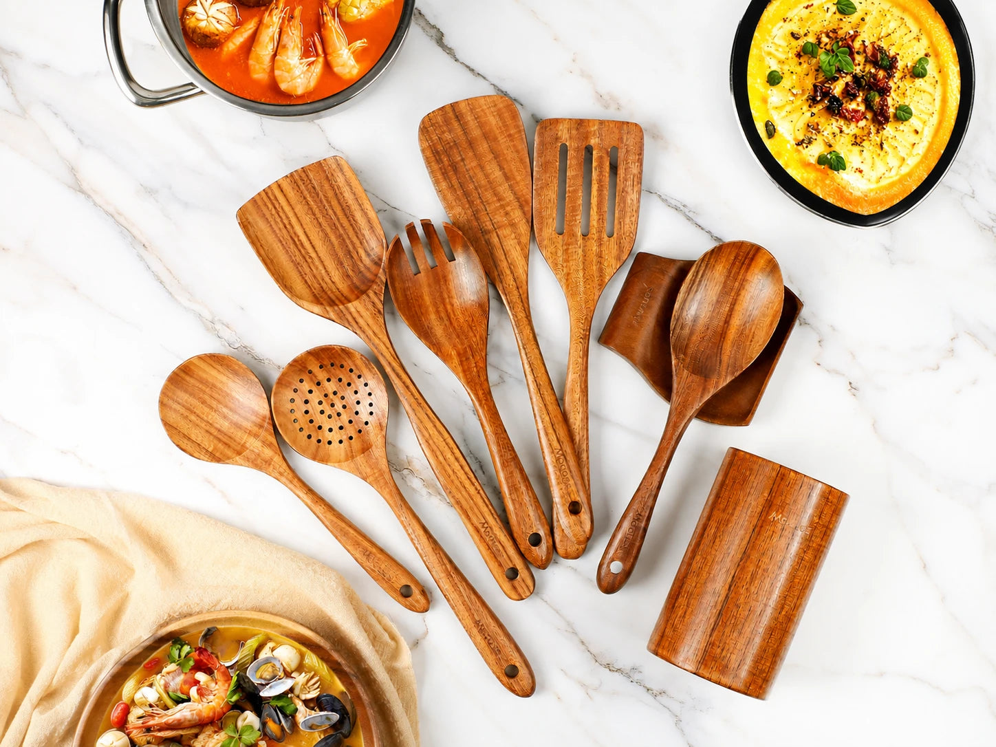 The nine-piece Mooues set: seven teak cooking utensils, one holder and one spoon rest