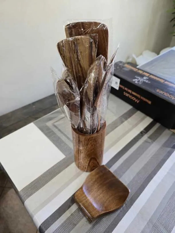 Customer unboxing photo of the Mooues teak utensil set