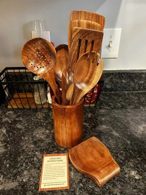 Customer photo of the Mooues teak utensil set, holder, and spoon rest on a kitchen counter
