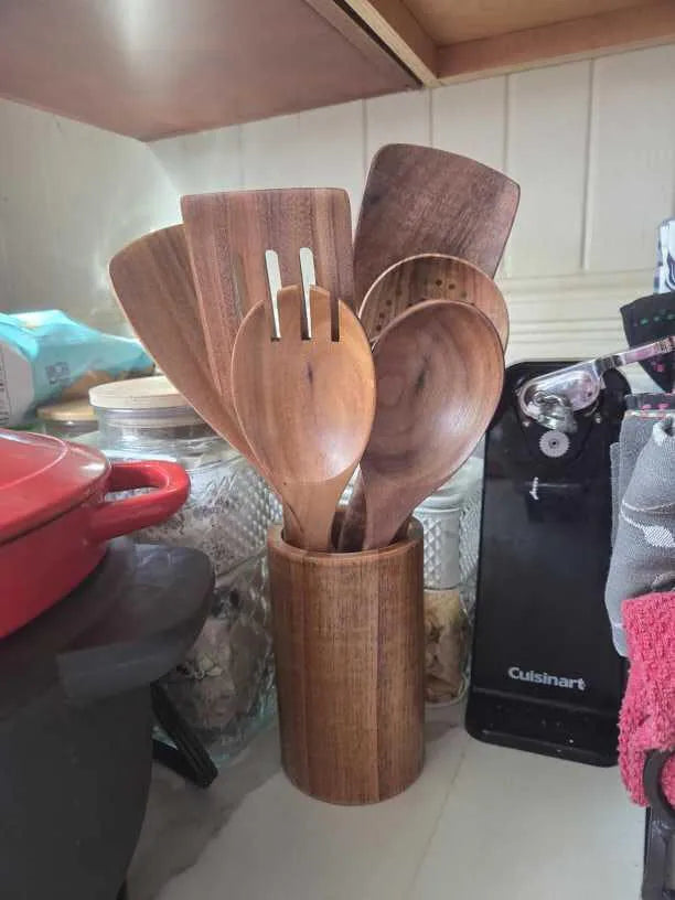 Customer countertop photo of a Mooues teak utensil set